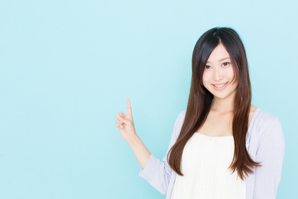 young asian woman showing on blue background